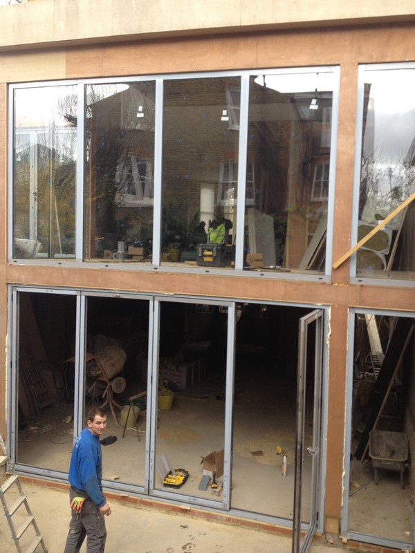 Aluminium bi-fold doors with two-storey glazing in Bicester