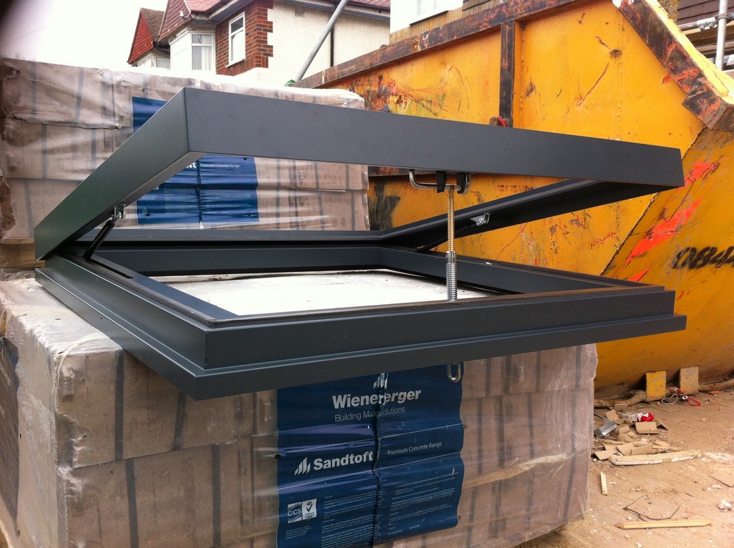 Opening flat roof skylight in anthracite grey installed in Bicester