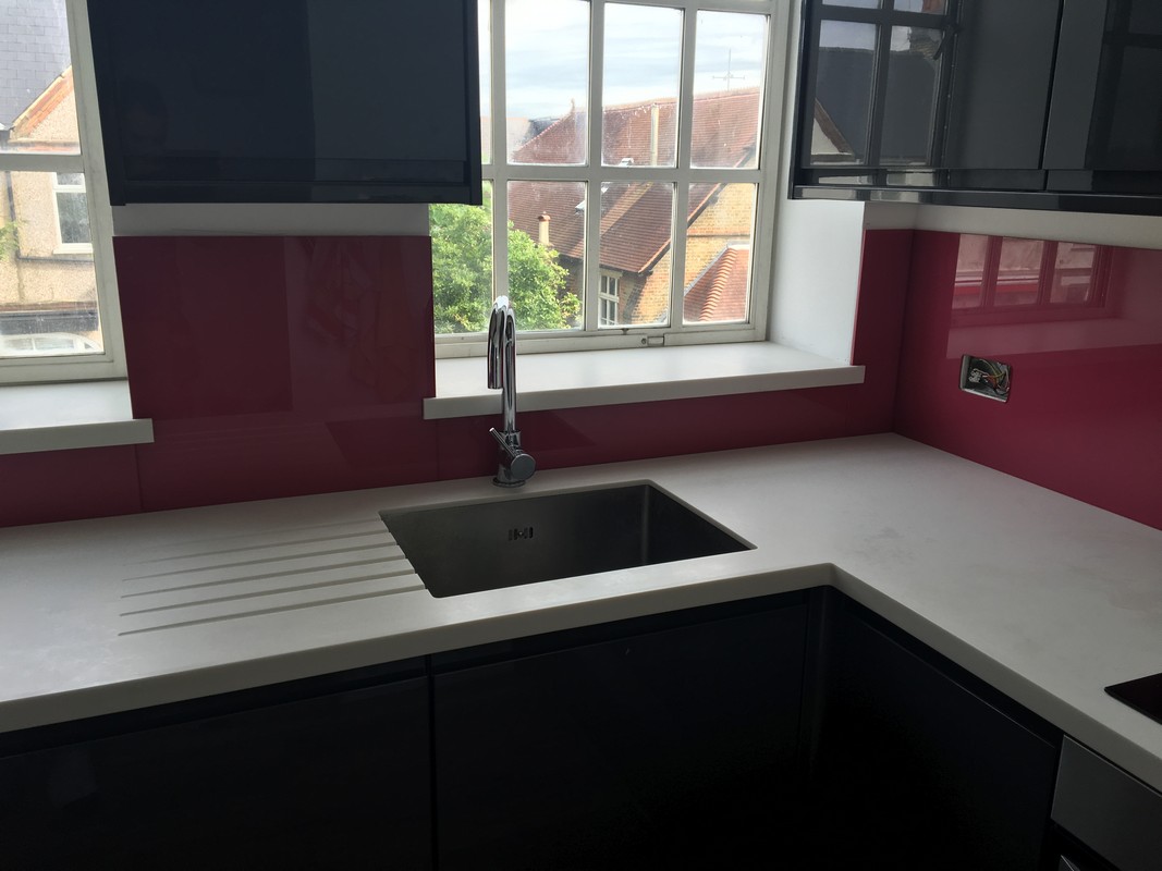 Deep plum coloured glass splashback in modern Bicester kitchen