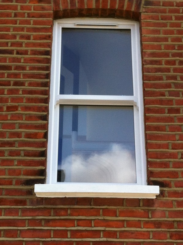 uPVC sash window on Victorian red brick house in Bicester